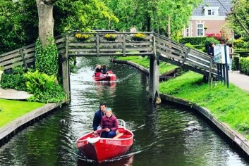 a group of people in a boat on a river
