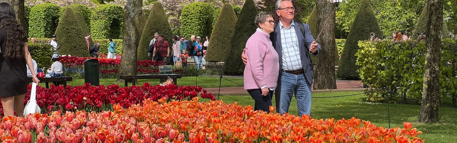 Couple enjoying colorful flower garden landscape