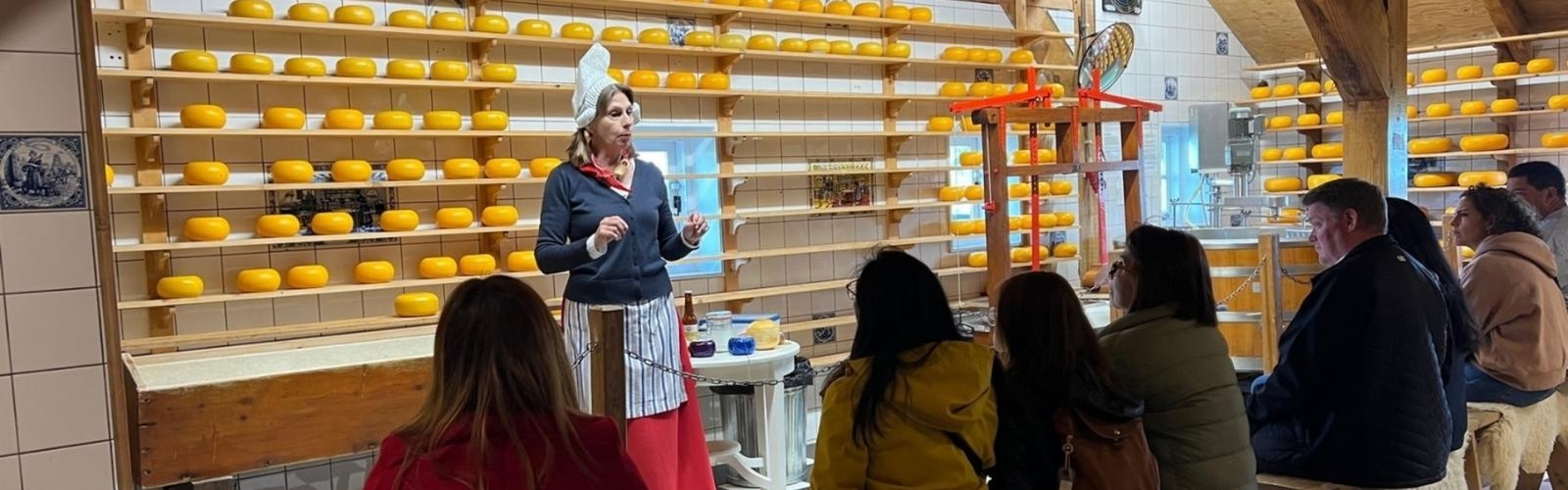 a woman standing in front of a group of people